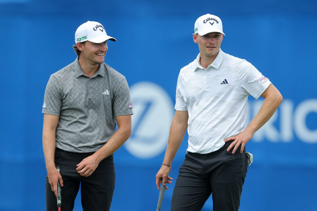 Rasmus Højgaard and Nicolai Højgaard speak during the first round of the Zurich Classic