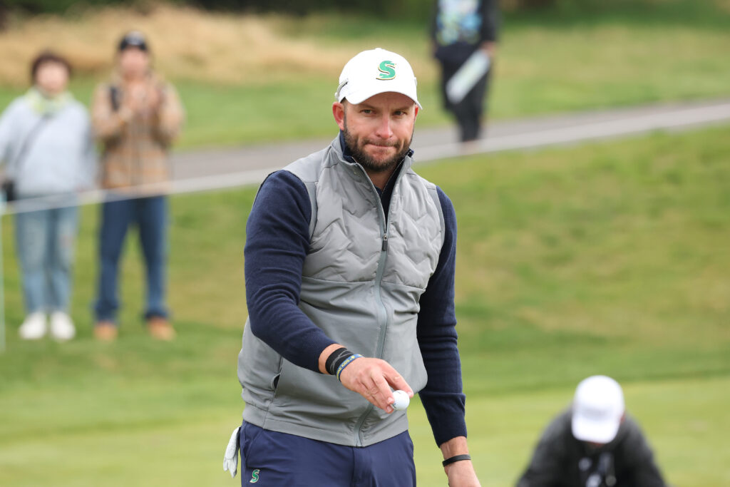 Dean Burmester of Stinger GC reacts after a birdie putt on the 3rd green on day two of LIV Golf Korea