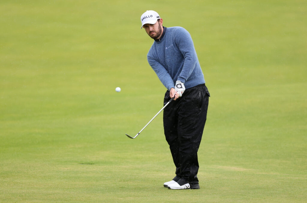 Patrick Cantlay chips onto the green during the first round of The Open Championship at Royal Portrush