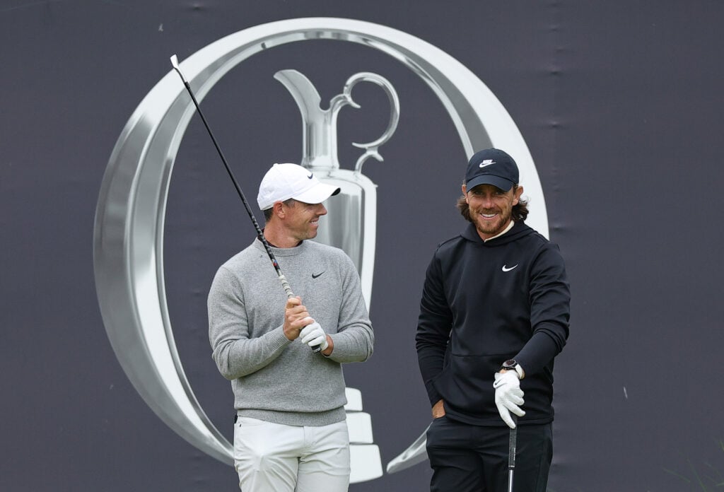Rory McIlroy and Tommy Fleetwood chat during the first round of The Open Championship