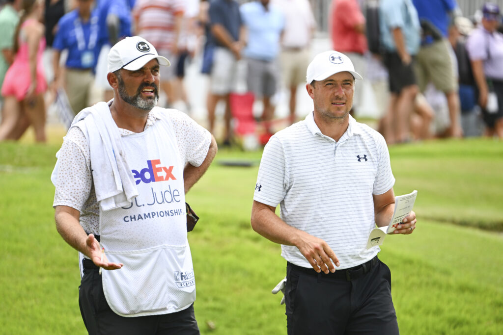 Jordan Spieth speaks to his caddie during round four of the FedEx St Jude Championship