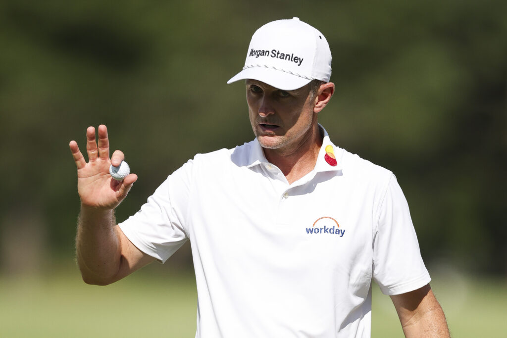 Justin Rose acknowledges fans after making a putt in round 4 of the FedEx St Jude