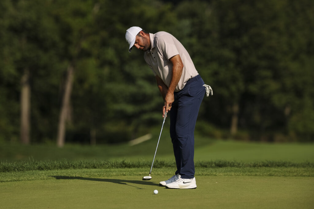 Scottie Scheffler hits a putt during the third round at the BMW Championship