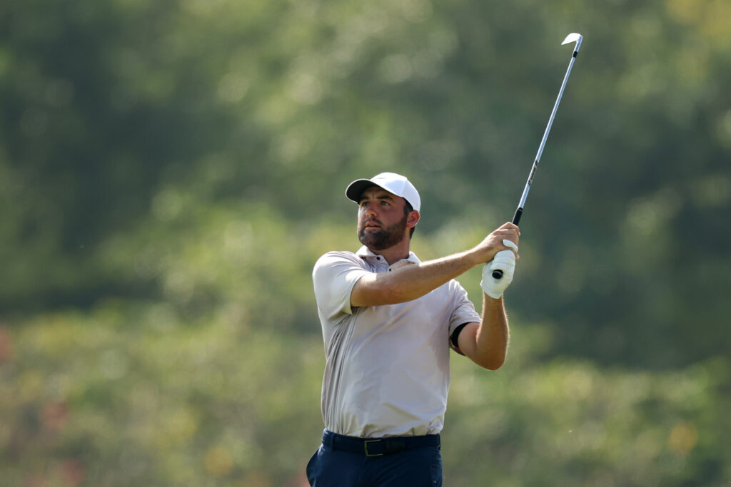 Scottie Scheffler hits an approach during the third round at the BMW Championship at Caves Valley