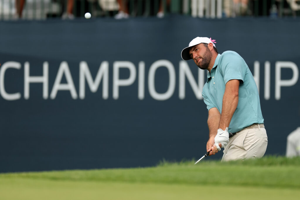Scottie Scheffler hits his chip shot on the 17th hole during the final round of the BMW Championship