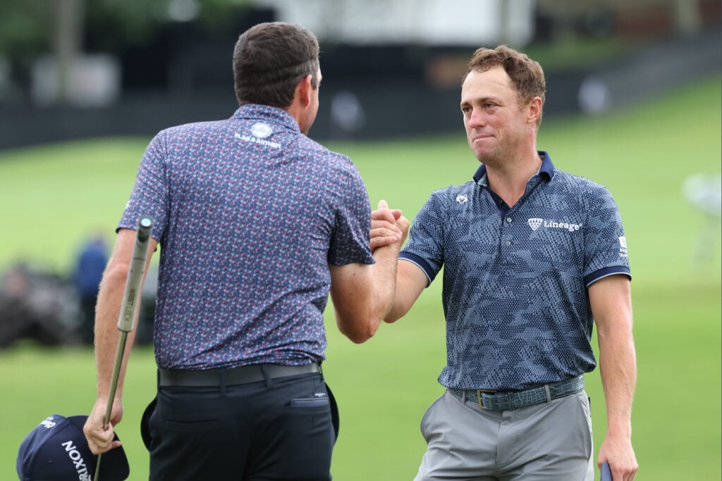 Justin Thomas shakes hands with Keegan Bradley after the third round of the Tour Championship