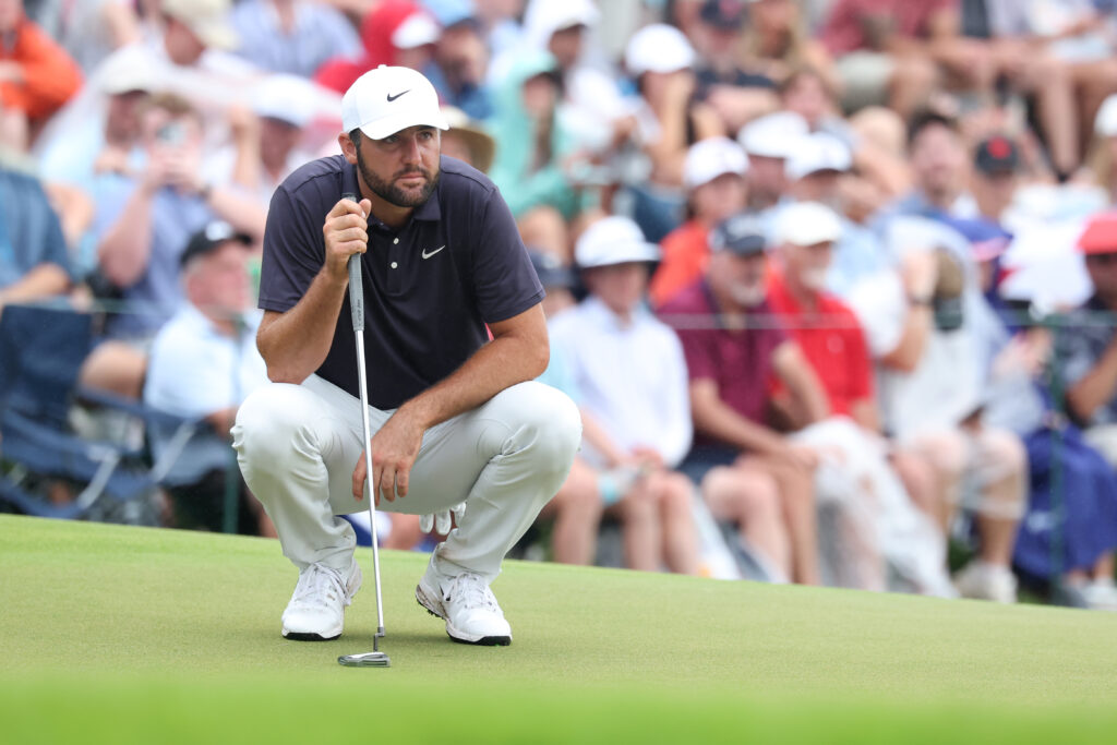 Scottie Scheffler lines up a putt during the third round of the Tour Championship