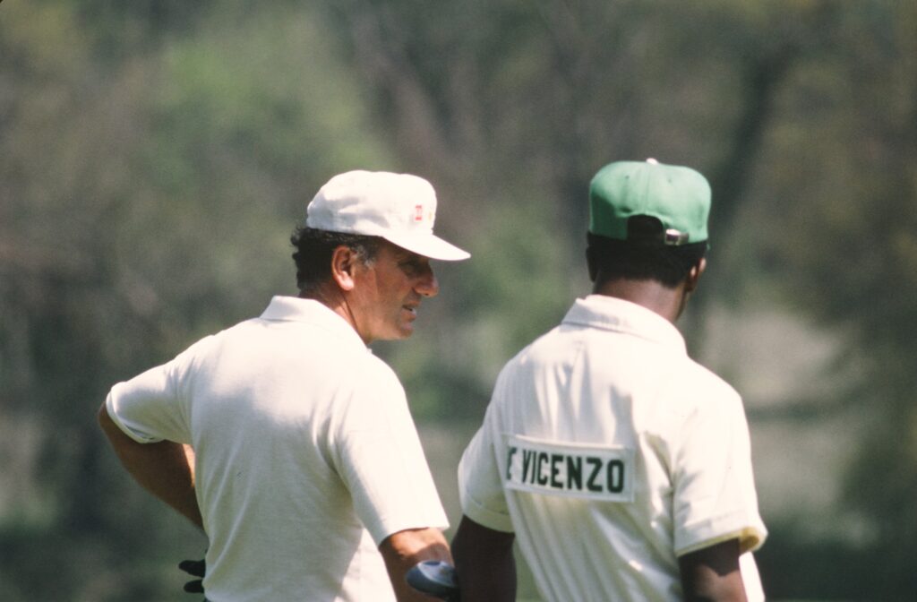 Roberto De Vicenzo chats with his caddie during the 1972 Masters