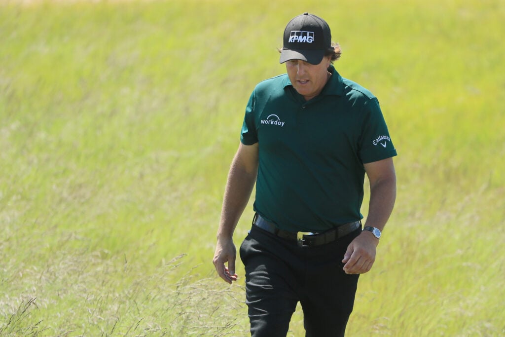 Phil Mickelson walks on the final green during the third round of the 2018 US Open