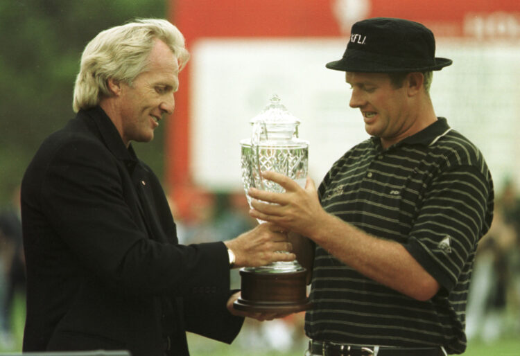 6 Feb 2000: Greg Norman (left) presents the trophy to  Lucas Parsons of Australia after Parsons won the Greg Norman Holden International with a fin...