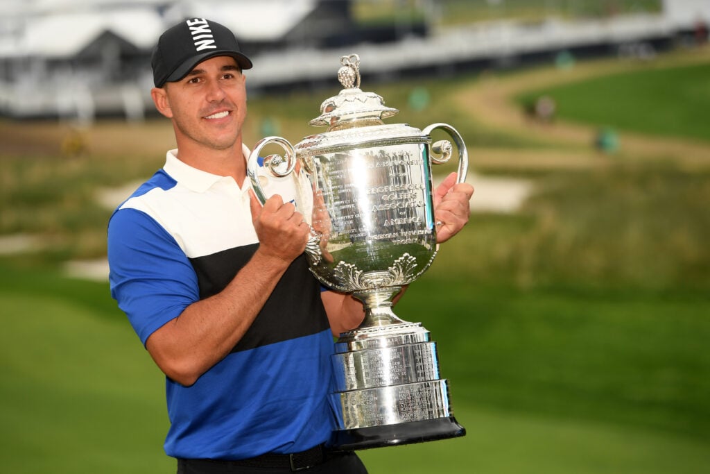 Brooks Koepka poses with the Wanamaker Trophy at the 2019 PGA Championship