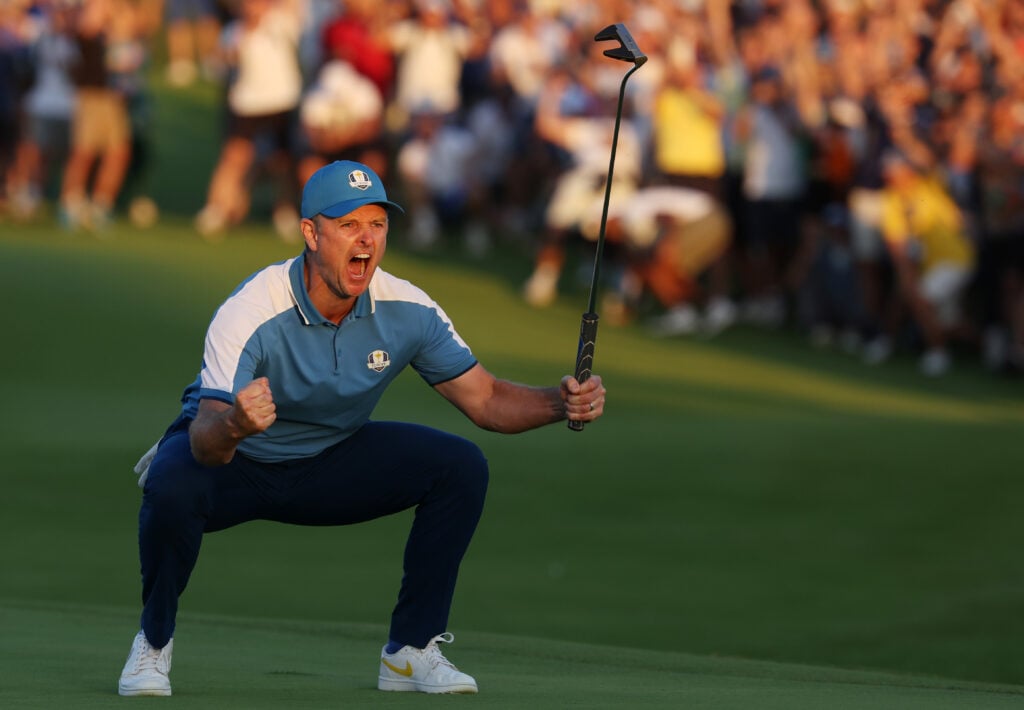 Justin Rose celebrates his putt to halve his match on day one at the 2023 Ryder Cup