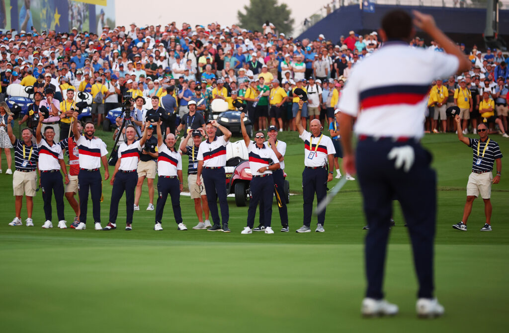 The American team react to Patrick Cantlay holing a putt on the second day of the 2023 Ryder Cup