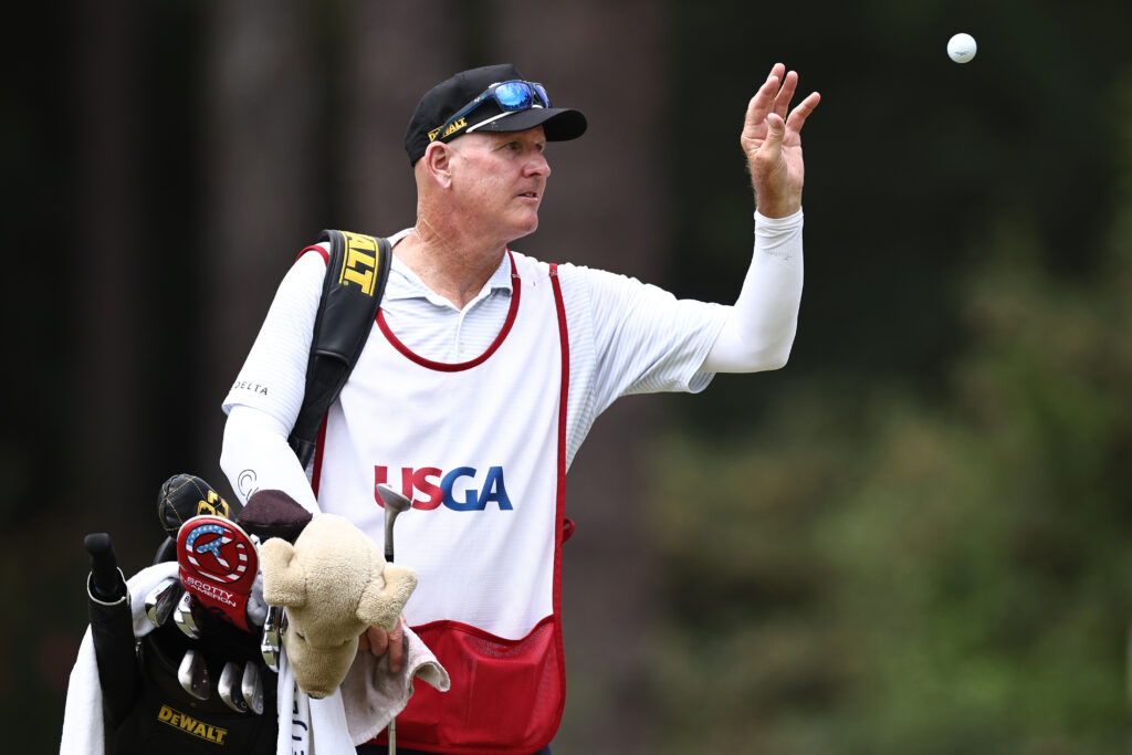 Joe LaCava catches a ball on the second hole green during the final round of the 124th U.S. Open at Pinehurst Resort
