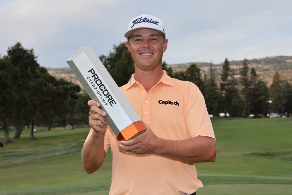 Patton Kizzire celebrates with the trophy after winning the after winning the Procore Championship