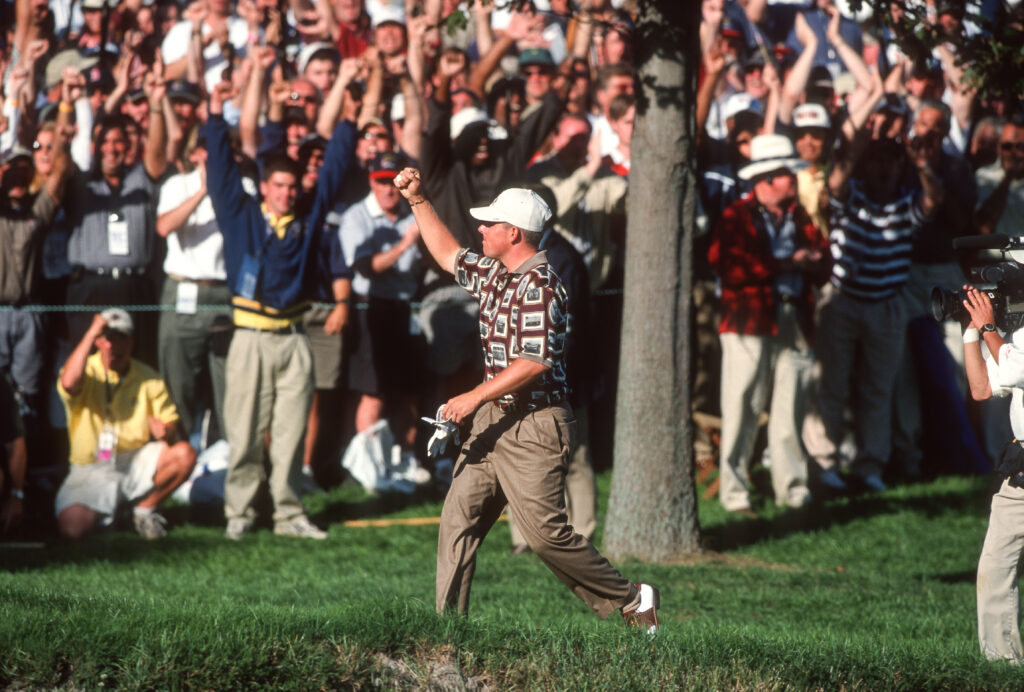 Justin Leonard reacts to holing his putt on the 17th hole on the final day of the 1999 Ryder Cup