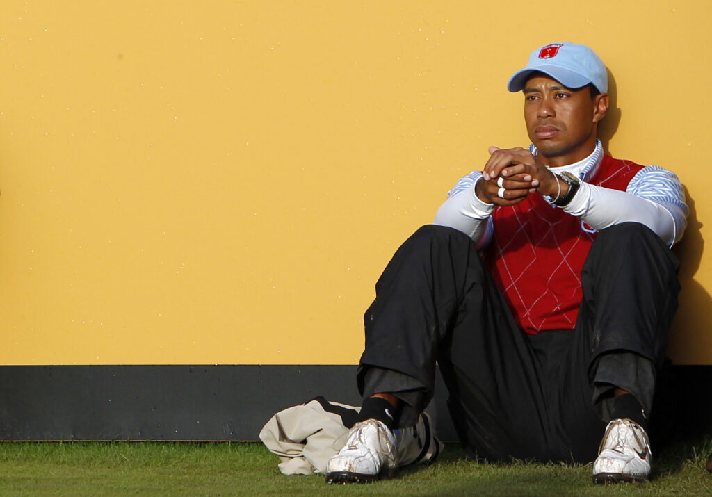 Tiger Woods sits on the 18th tee after losing his match on Sunday at the 2010 Ryder Cup at Celtic Manor