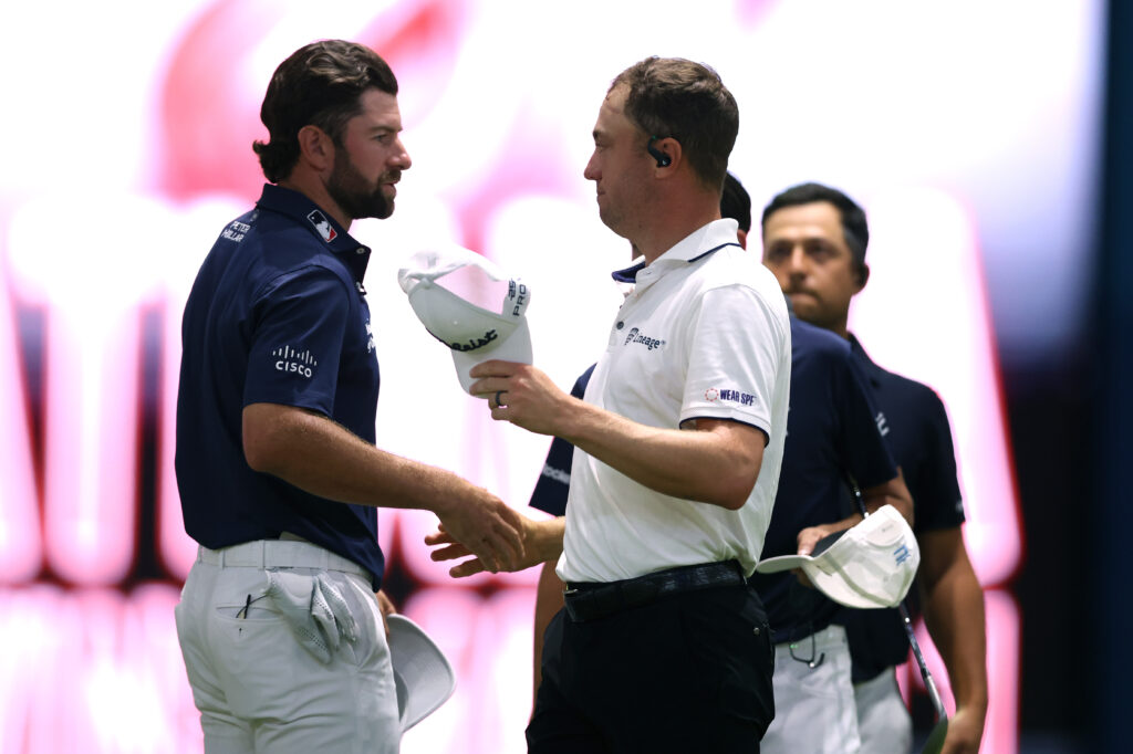 Cameron Young of New York Golf Club and Justin Thomas of Atlanta Drive GC shake hands after their TGL presented by SoFi match at SoFi Center