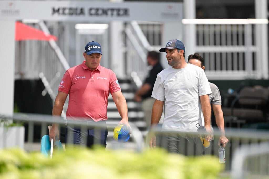 Sepp Straka of Austria and Scottie Scheffler arrives to the course during the final round of the Travelers Championship at TPC River Highlands