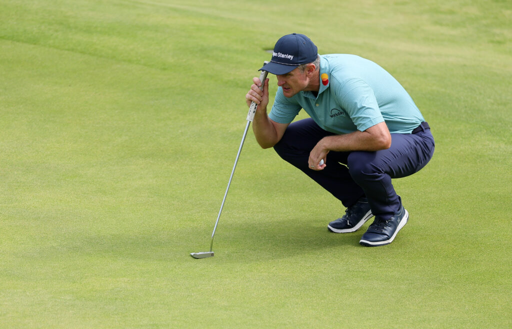 Justin Rose of England lines up a putt on the 18th green during day four of The 153rd Open Championship at Royal Portrush Golf Club