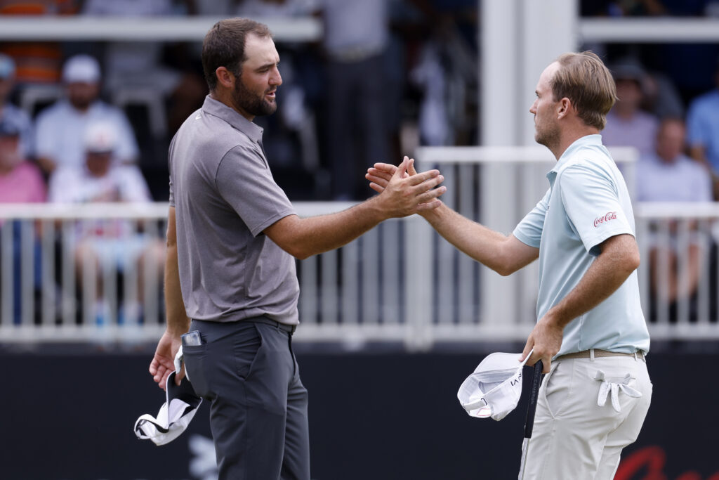 Scottie Scheffler and Russell Henley shake hands following their second round of the Tour Championship at East Lake