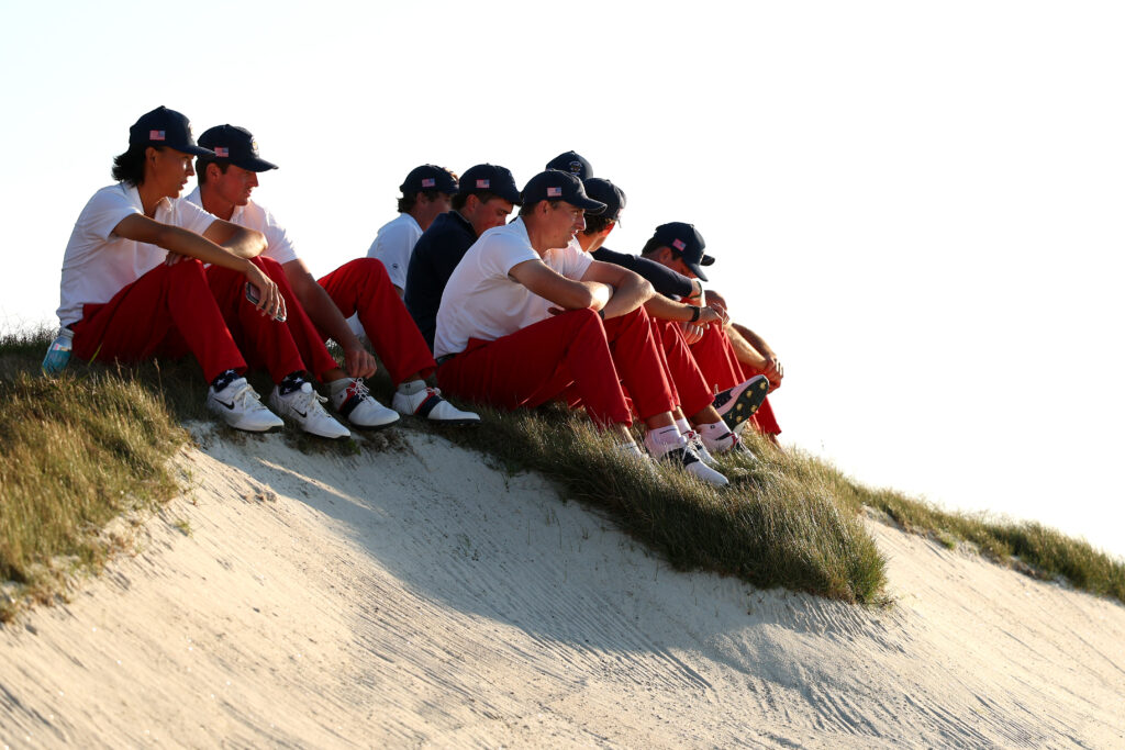 Members of Team United States sit near the 17th green in Saturday singles during Day One of The 50th Walker Cup at Cypress Point Club