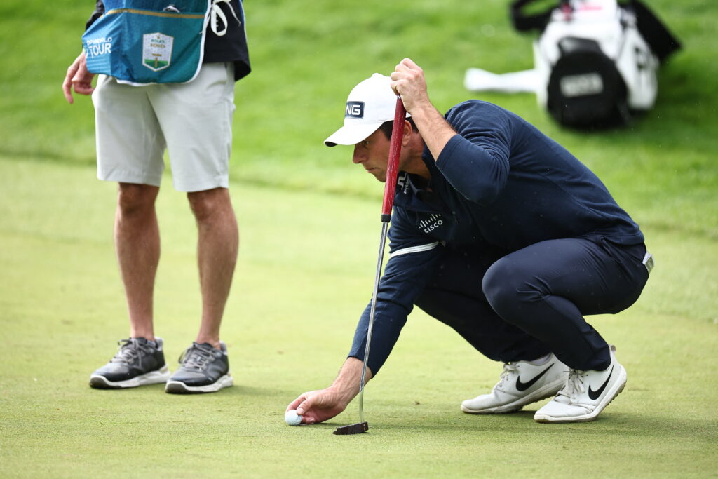 Viktor Hovland lines up a putt during the first round of the BMW PGA Championship at Wentworth