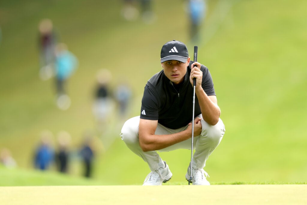 Ludvig Aberg lines up a putt on the first green on day one of the BMW PGA Championship 2025
