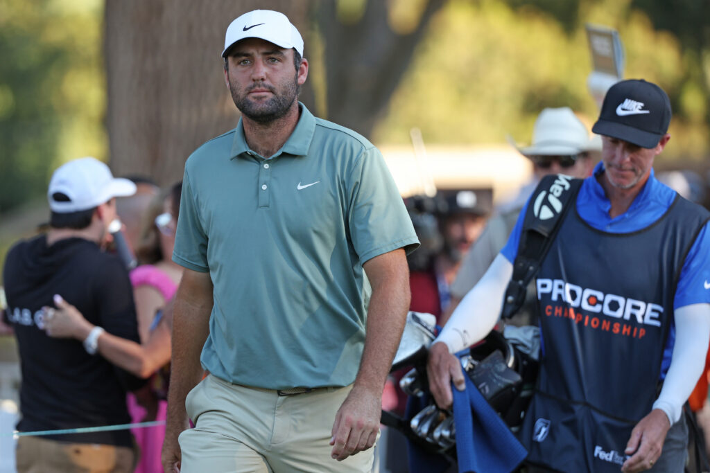 Scottie Scheffler with his caddie Ted Scott during round 4 of the Procore Championship