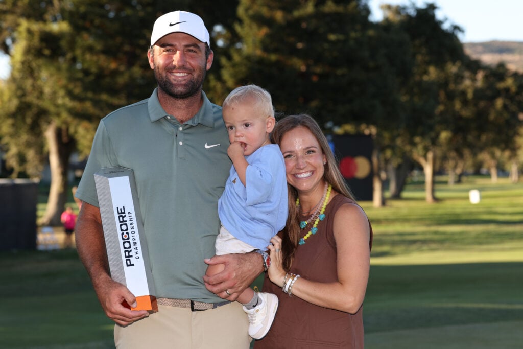 Scottie Scheffler celebrates winning the Procore Championship with his wife and son