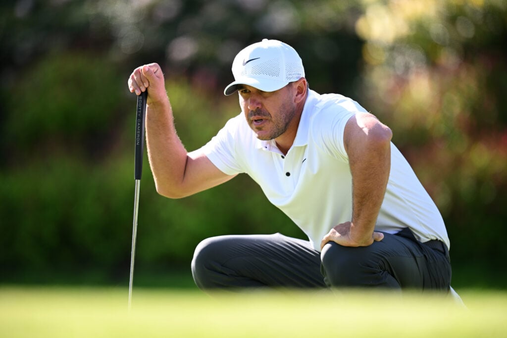 Brooks Koepka of the United States lines up a putt on the fourth green on day one of the FedEx Open de France 2025