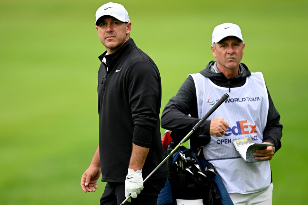 Brooks Koepka looks on with his caddy during round three of the French Open