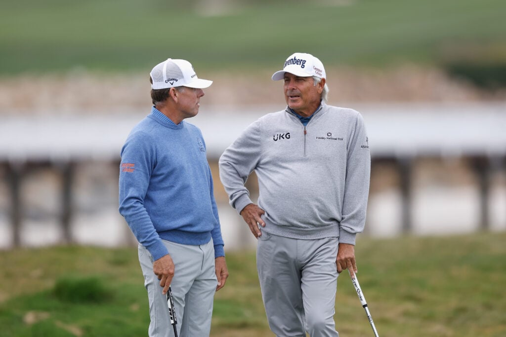 Justin Leonard and Fred Couples speak during the final round at the PURE Insurance Championship