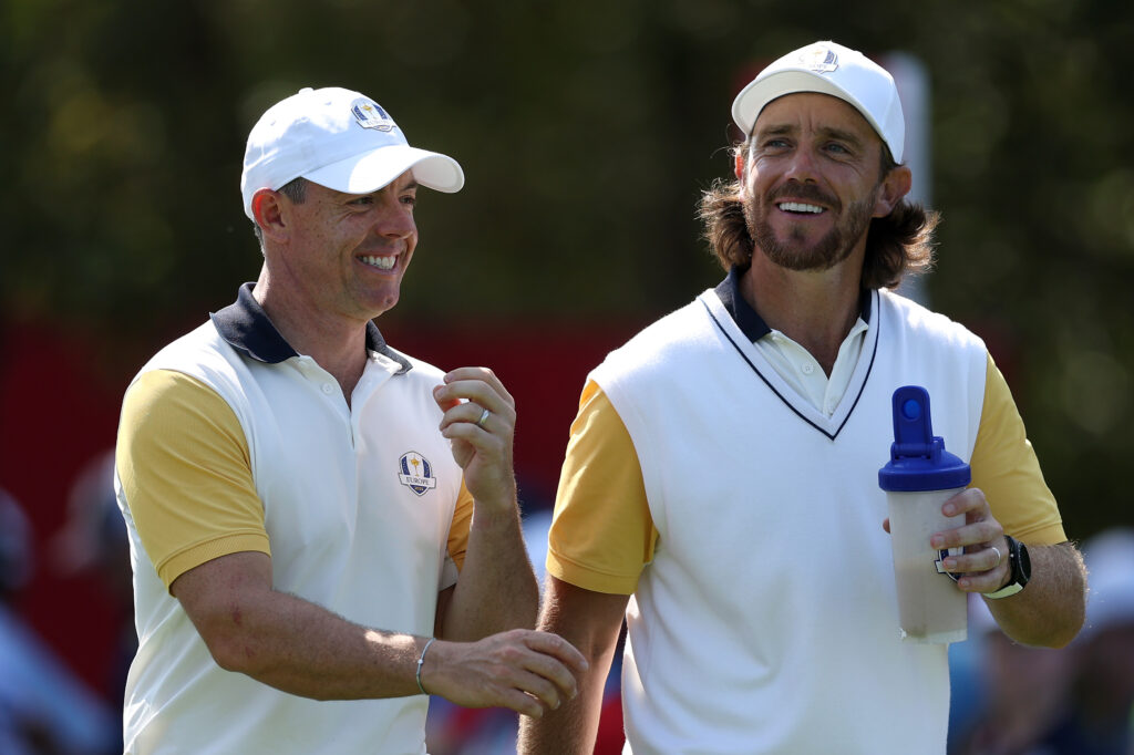 Rory McIlroy talks with Tommy Fleetwood prior to the Ryder Cup 2025