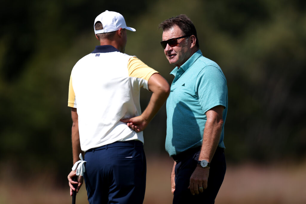Sir Nick Faldo talks with Ludvig Aberg of Team Europe during a practice round prior to the Ryder Cup 2025