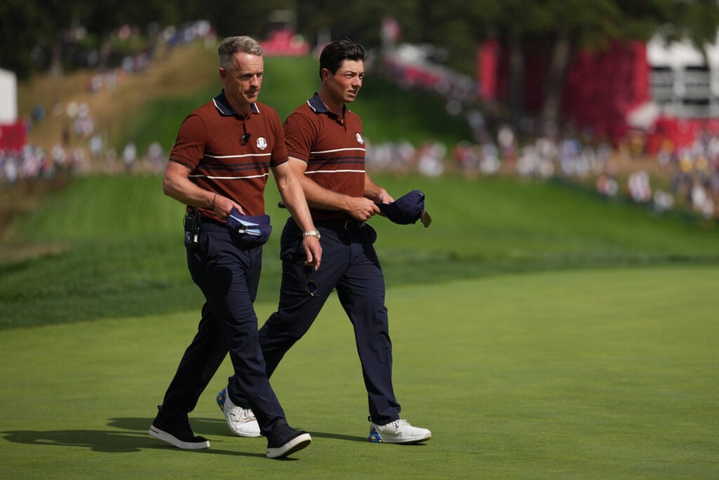 Captain Luke Donald and Viktor Hovland of Team Europe walk at the 2025 Ryder Cup.