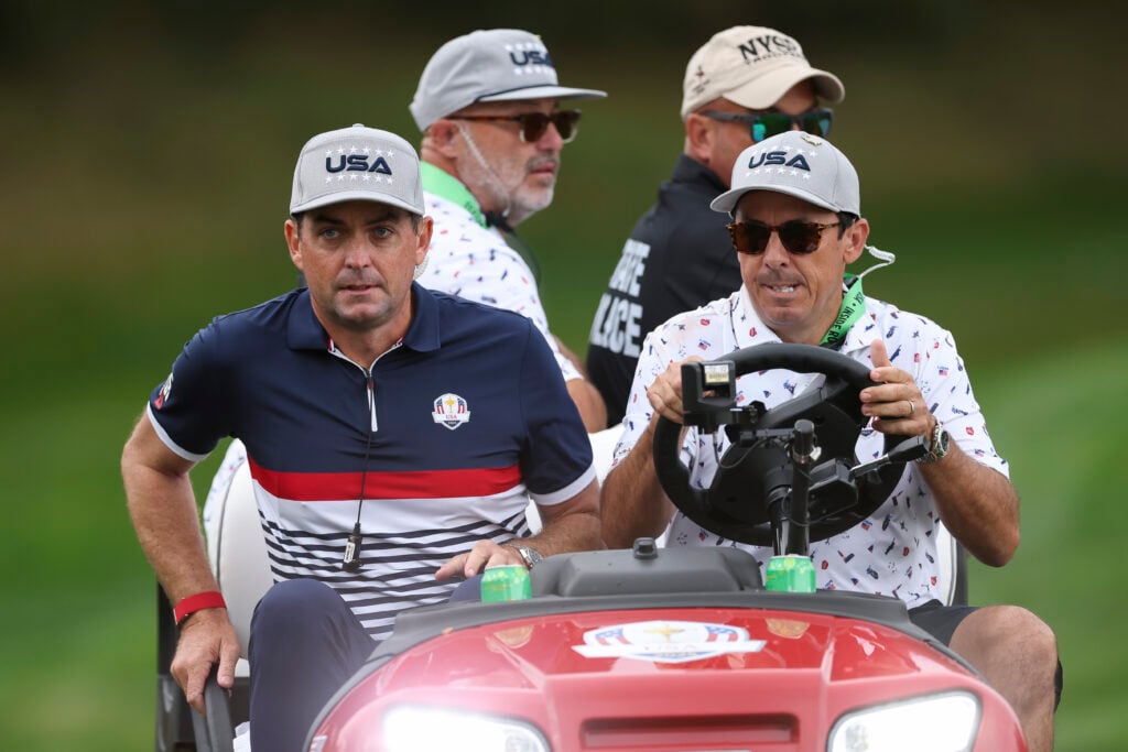 Keegan Bradley is driven on a cart during the Friday morning foursomes matches at the Ryder Cup at Bethpage Black