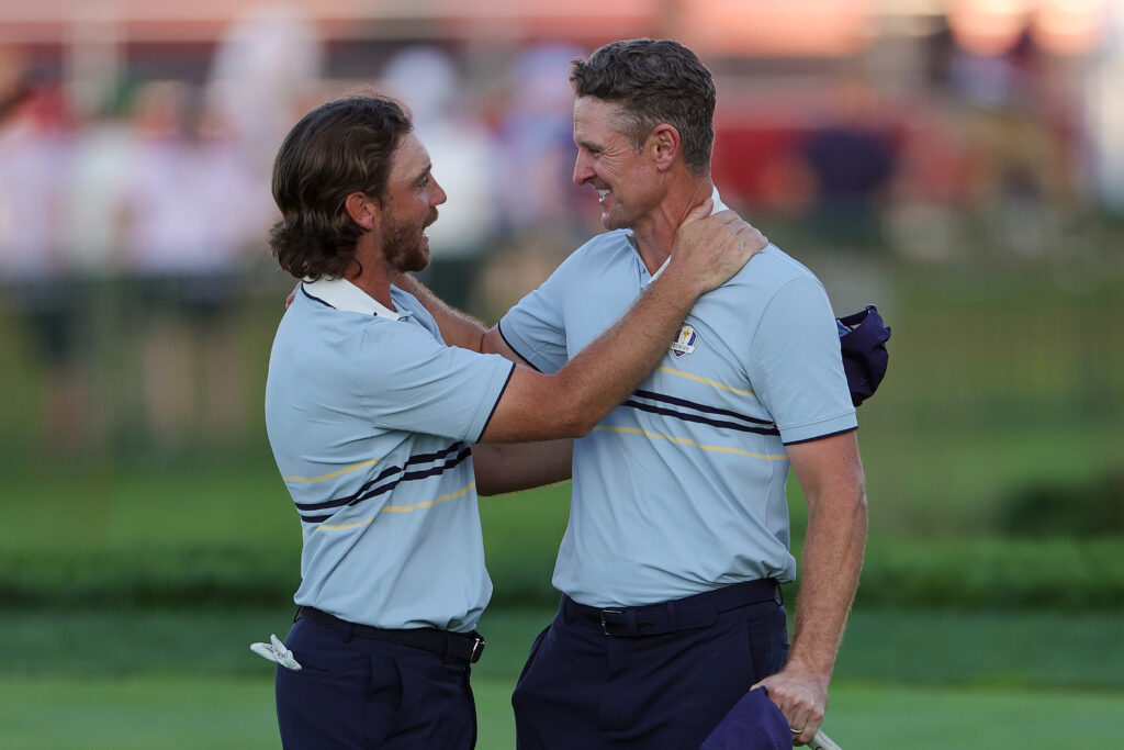 Tommy Fleetwood of Team Europe celebrates with teammate Justin Rose at the 2025 Ryder Cup.