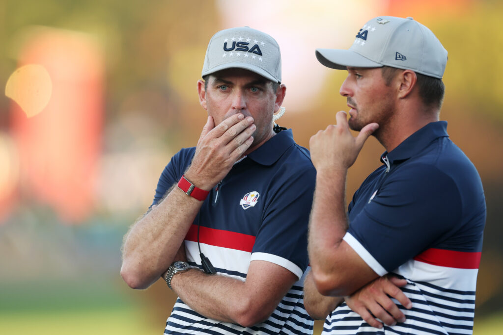 Keegan Bradley speaks with Bryson DeChambeau during the Saturday afternoon session at the Ryder Cup
