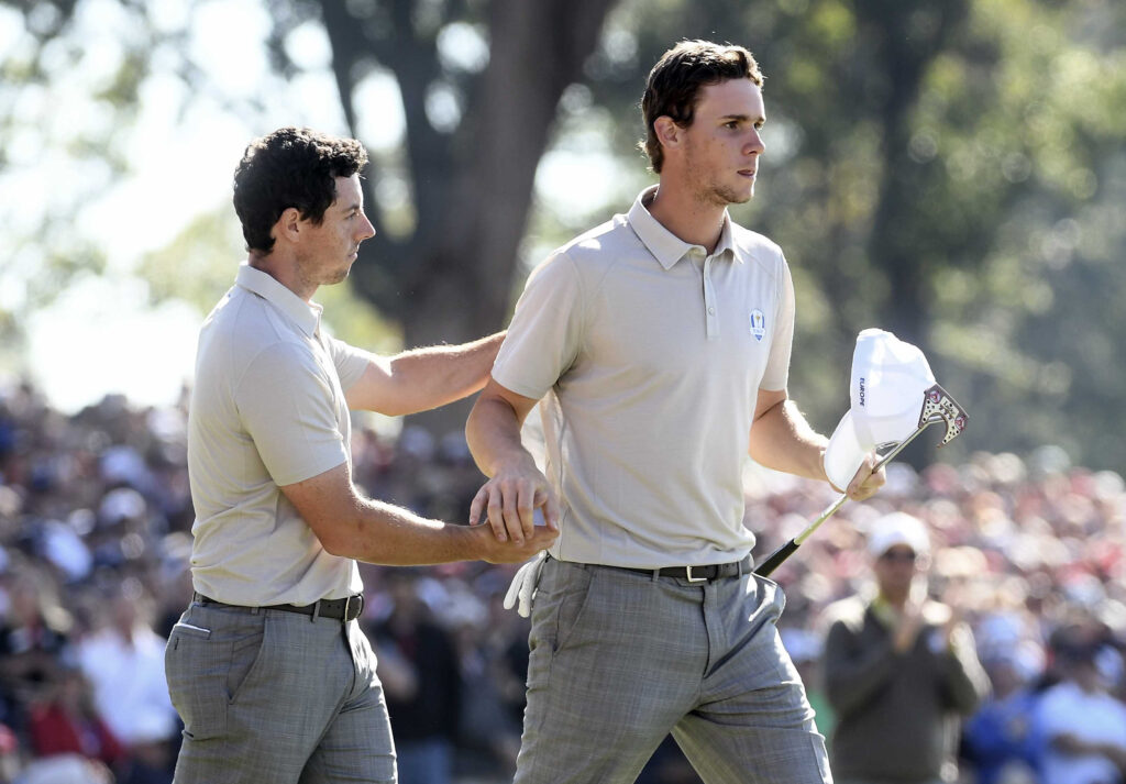 Rory McIlroy and Thomas Pieters celebrate their win at the 2016 Ryder Cup