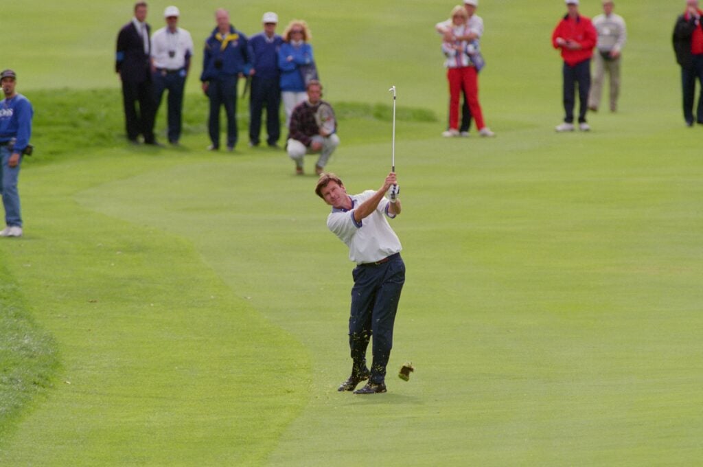 Nick Faldo of Europe plays a great approach on the 18th to set up victory in his final day singles match during the Ryder Cup at Oak Hill