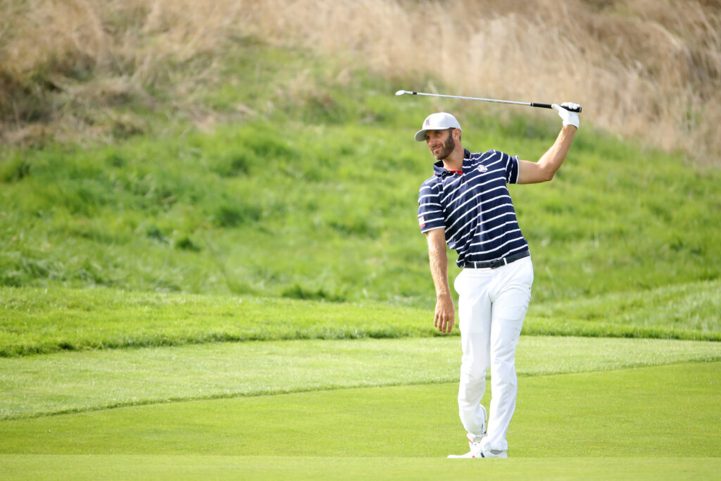 Dustin Johnson reacts to an approach shot during the 2018 Ryder Cup