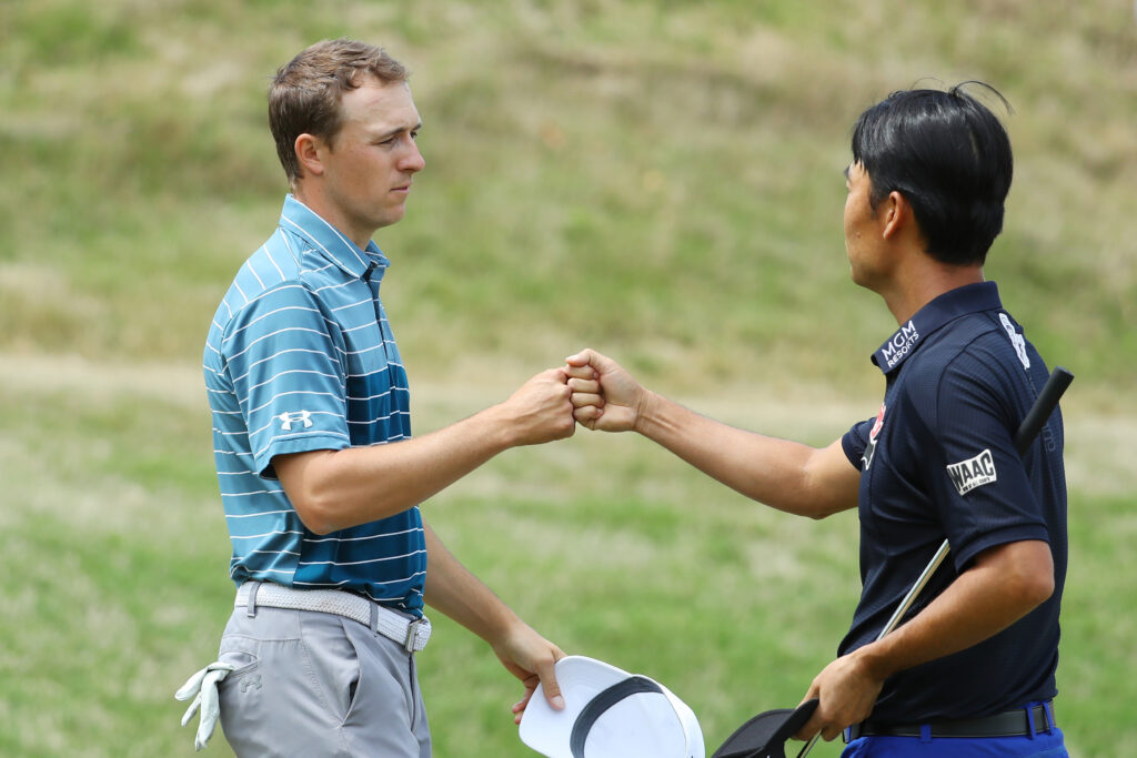 Jordan Spieth with Kevin Na on the 16th green after defeating him 3&2 at the World Golf Championships-Dell Technologies at Austin Country Club