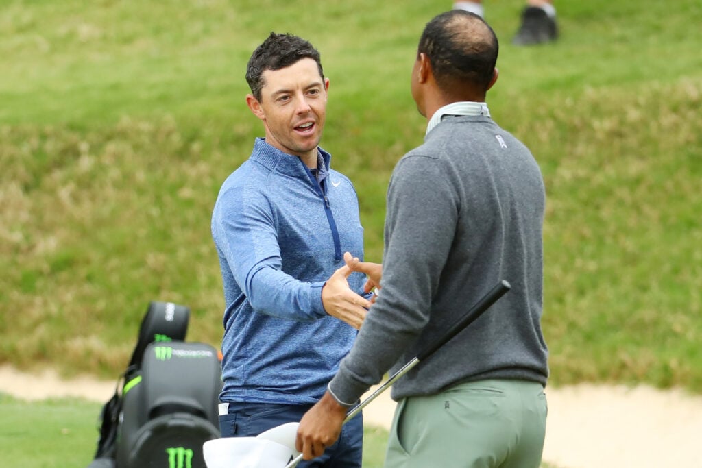 Rory McIlroy and Tiger Woods shake hands on the 17th hole at the 2019 WGC Match Play
