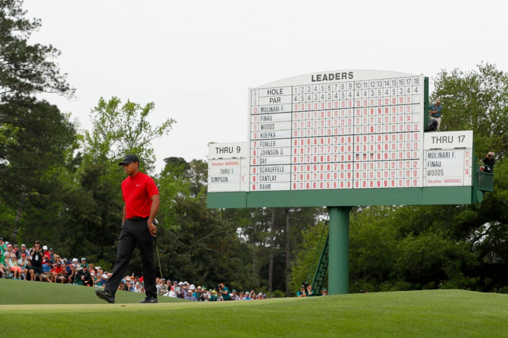 Tiger Woods stands on the 18th green during the final round at the 2019 Masters