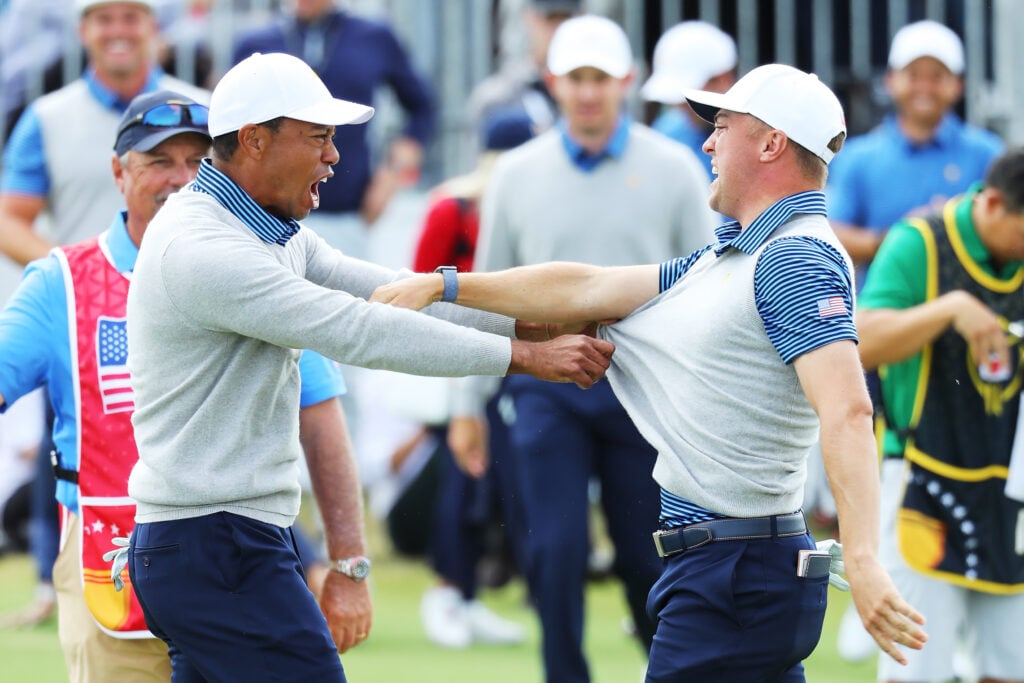 Playing Captain Tiger Woods of the United States team and Justin Thomas of the United States team celebrate at the 2019 Presidents Cup