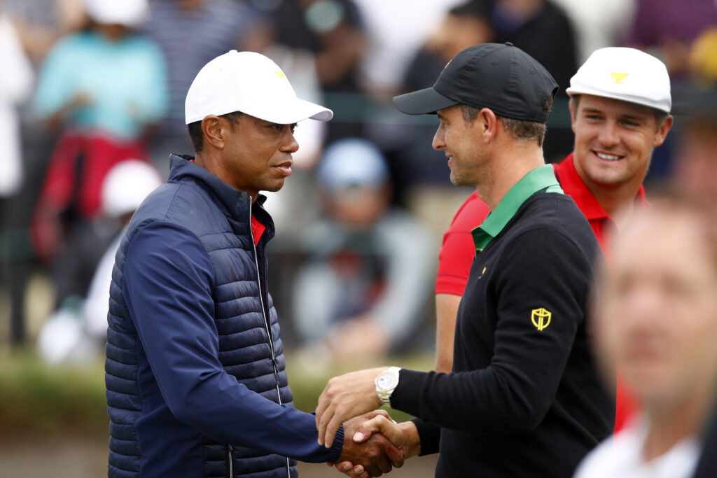 Adam Scott and Tiger Woods shake hands after the 2019 Presidents Cup