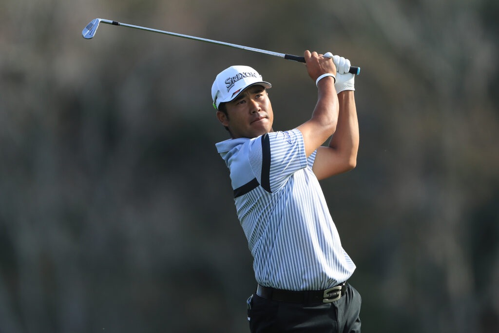 Hideki Matsuyama hits his approach during the first round of the 2020 Players Championship