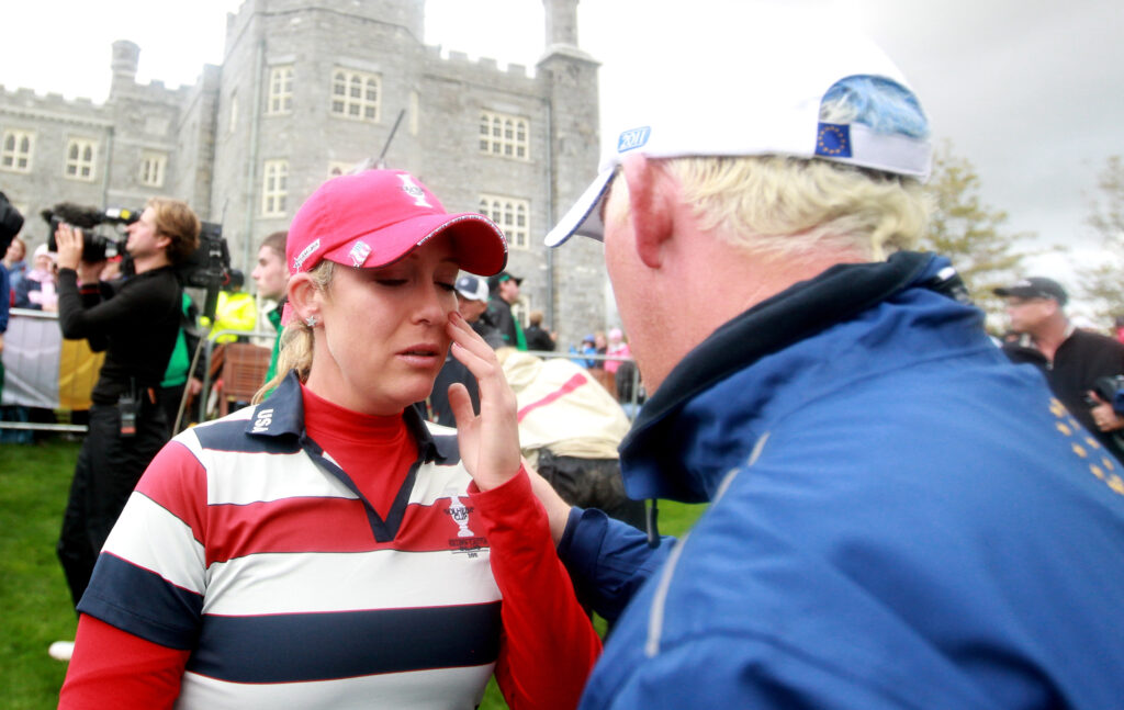 Cristie Kerr is consoled after withdrawing from her singles match at the 2011 Solheim Cup