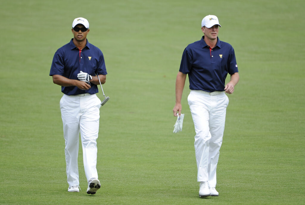 Tiger Woods and Steve Stricker walk down the fairway during the first day of the 2011 Presidents Cup